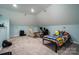 Bonus room with gaming setup and recliner at 6238 Mountain Vine Ave, Kannapolis, NC 28081