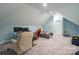 Bonus room with gaming setup and recliner at 6238 Mountain Vine Ave, Kannapolis, NC 28081