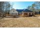 View of the home's exterior, showcasing the deck and landscaping at 6238 Mountain Vine Ave, Kannapolis, NC 28081