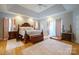 Main bedroom with plush carpet, large windows, and ample natural light at 6238 Mountain Vine Ave, Kannapolis, NC 28081