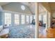 Bright sunroom features vaulted ceiling, large windows, and tile flooring at 6238 Mountain Vine Ave, Kannapolis, NC 28081