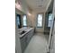 Double vanity bathroom with gray cabinets and a walk-in shower at 718 Barrel Aly, Fort Mill, SC 29715