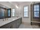 Bathroom featuring a dual sink vanity, marble countertops, and glass shower with a bench at 718 Barrel Aly, Fort Mill, SC 29715