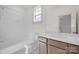 Bright bathroom featuring a tub, tiled walls, toilet, and sink with wooden drawers at 718 Barrel Aly, Fort Mill, SC 29715