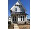 Two-story craftsman home with gray siding, black metal roof, and stone accents at 718 Barrel Aly, Fort Mill, SC 29715