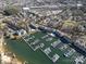 Aerial view of a large marina community with swimming pools, tennis courts, and multiple docks at 8125 Houser St, Cornelius, NC 28031