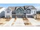 New construction townhomes with attached garages and modern finishes at 8125 Houser St, Cornelius, NC 28031