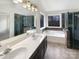 Bathroom with double vanity, soaking tub, and walk-in shower at 8200 Suttonview Dr, Charlotte, NC 28269