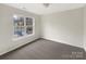 Well-lit bedroom with carpet and window view at 8200 Suttonview Dr, Charlotte, NC 28269