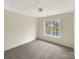 Simple bedroom with carpet and a window view at 8200 Suttonview Dr, Charlotte, NC 28269