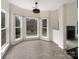 Bright breakfast area with tile floors and view of backyard at 8200 Suttonview Dr, Charlotte, NC 28269