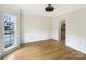 Formal dining room with hardwood floors and wainscoting at 8200 Suttonview Dr, Charlotte, NC 28269