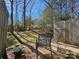 Private backyard with gravel patio and wooden fence at 8225 Pineville Matthews Rd # H, Charlotte, NC 28226