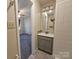 Bathroom with vanity and shower. Connects to bedroom at 8225 Pineville Matthews Rd # H, Charlotte, NC 28226