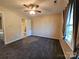 Bedroom with ceiling fan, carpeting, and access to bathroom at 8225 Pineville Matthews Rd # H, Charlotte, NC 28226