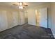 Spacious bedroom with carpet flooring and multiple closets at 8225 Pineville Matthews Rd # H, Charlotte, NC 28226