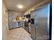 Kitchen with stainless steel appliances and gray cabinets at 8225 Pineville Matthews Rd # H, Charlotte, NC 28226