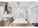 A well-equipped kitchen featuring an island with a sink, modern appliances, and sleek countertops at 8228 Moores Chapel Rd, Charlotte, NC 28214