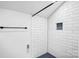 White tiled shower with rain shower head and built in storage nook at 8228 Moores Chapel Rd, Charlotte, NC 28214