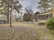 Yard with shed, trees, and screened porch at 860 Nightingale Rd, Rock Hill, SC 29732