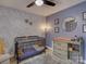 Bedroom with crib, changing table, and lovely accent wall at 860 Nightingale Rd, Rock Hill, SC 29732