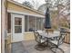 Deck with table and chairs, adjacent to a screened porch at 860 Nightingale Rd, Rock Hill, SC 29732