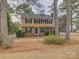 Two-story house with a yellow exterior, blue door, and landscaping at 860 Nightingale Rd, Rock Hill, SC 29732