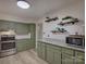 Modern kitchen with green cabinets and marble countertops at 860 Nightingale Rd, Rock Hill, SC 29732