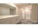 Modern bathroom with double vanity, large mirror, and a shower stall at 866 Two Brothers Ln, York, SC 29745