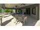 Covered patio area with tables and chairs near the pool at 866 Two Brothers Ln, York, SC 29745