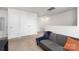 Spacious loft area with gray couch and ample closet space at 9025 Creedmore Hills Dr, Charlotte, NC 28214