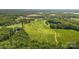 Aerial view showing a large lot surrounded by trees at Lot 1 Mayes Meadow Dr # Devonshire, Cornelius, NC 28078