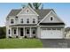 Two-story house with gray siding, white accents, and a two-car garage at Lot 1 Mayes Meadow Dr # Devonshire, Cornelius, NC 28078