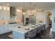 Contemporary kitchen with white cabinets, a light grey island, and wicker barstools at Lot 1 Mayes Meadow Dr # Devonshire, Cornelius, NC 28078