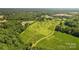 Aerial view of a land lot with a tree-lined perimeter and access road at Lot 1 Mayes Meadow Dr # Magnolia, Cornelius, NC 28078