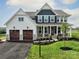 Two-story house, white and blue siding, two-car garage, and a landscaped lawn at Lot 1 Mayes Meadow Dr # Magnolia, Cornelius, NC 28078