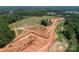 Aerial view of property showcasing land features, equipment and active construction phase at Lot 11 Mayes Meadow Dr # Devonshire, Cornelius, NC 28078