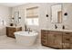 Bright bathroom featuring dual sinks, soaking tub, and tasteful dark wood cabinetry at Lot 11 Mayes Meadow Dr # Devonshire, Cornelius, NC 28078