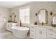 Bright bathroom featuring dual sinks, soaking tub, and tasteful marble tiling at Lot 11 Mayes Meadow Dr # Devonshire, Cornelius, NC 28078