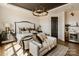 A beautifully decorated bedroom with a sitting area and modern chandelier at Lot 11 Mayes Meadow Dr # Devonshire, Cornelius, NC 28078