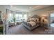 A spacious bedroom with plush carpeting and plenty of natural light at Lot 11 Mayes Meadow Dr # Devonshire, Cornelius, NC 28078