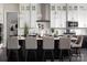 Bright kitchen with modern appliances, white cabinets, and island seating with stylish bar stools at Lot 11 Mayes Meadow Dr # Devonshire, Cornelius, NC 28078