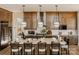 Elegant kitchen with wood cabinets, an island with seating, and modern pendant lights at Lot 11 Mayes Meadow Dr # Devonshire, Cornelius, NC 28078