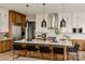 Elegant kitchen with island seating, stainless appliances, and modern pendant lights at Lot 11 Mayes Meadow Dr # Devonshire, Cornelius, NC 28078