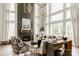 Elegant living room featuring a fireplace, high ceilings, large windows, and stylish decor at Lot 11 Mayes Meadow Dr # Devonshire, Cornelius, NC 28078