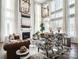 Elegant living room with soaring windows, fireplace, and stylish furnishings creating a bright, inviting space at Lot 11 Mayes Meadow Dr # Devonshire, Cornelius, NC 28078