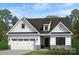 Beautiful two-story home with white siding, black accents, and a two-car garage at Lot 109 Mayes Meadow Dr # Woodford, Cornelius, NC 28078