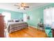 Large bedroom with hardwood floors, ceiling fan, and light teal walls at 1012 Rawlinson Rd, Rock Hill, SC 29732