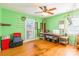 Versatile bedroom with hardwood floors, large window, and green walls at 1012 Rawlinson Rd, Rock Hill, SC 29732