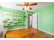 Bedroom with built-in shelving and ceiling fan at 1012 Rawlinson Rd, Rock Hill, SC 29732